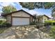 Charming single-Gathering home with a two car garage and stone facade at 16517 Norwood Dr, Tampa, FL 33624