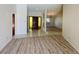Inviting foyer with stylish tile and wood flooring, leading to the living areas at 16517 Norwood Dr, Tampa, FL 33624