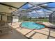 Screened in swimming pool with a patio area and ceiling fan at 16517 Norwood Dr, Tampa, FL 33624