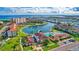 This aerial view shows resort-style amenities, a waterfront community, a pool, and a putting green at 19029 Us Highway 19 N # 2-23, Clearwater, FL 33764