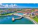 Aerial view of the canal-front community with pool, tennis, and clubhouse at 19029 Us Highway 19 N # 2-23, Clearwater, FL 33764