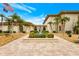 Beautiful exterior and landscaping with palm trees, an American flag, and a lovely stone fountain at 19029 Us Highway 19 N # 2-23, Clearwater, FL 33764