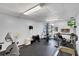 Community gym with a treadmill, stationary bike, and universal weight machine for residents' workout needs at 19029 Us Highway 19 N # 2-23, Clearwater, FL 33764