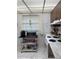 Efficient kitchen with marble-look countertops, essential appliances, and ample storage at 19029 Us Highway 19 N # 2-23, Clearwater, FL 33764