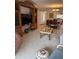 Spacious living room with an entertainment center and cozy seating at 19029 Us Highway 19 N # 2-23, Clearwater, FL 33764