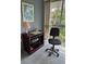 Office space featuring a window with green outdoor view and blue carpet at 19029 Us Highway 19 N # 2-23, Clearwater, FL 33764