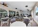 Spacious covered outdoor dining area with ceiling fans and multiple tables for enjoying meals and gatherings at 19029 Us Highway 19 N # 2-23, Clearwater, FL 33764