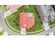 Stunning aerial view of a home with a tile roof, screened-in pool, and lush landscaping at 19107 Avenue Bayonnes, Lutz, FL 33558