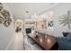 Open-concept dining area with stylish chairs and a large table, perfect for Gathering dinners at 19107 Avenue Bayonnes, Lutz, FL 33558