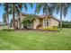 Beautiful single-story home with lush landscaping, a tile roof, and a well-manicured lawn at 19107 Avenue Bayonnes, Lutz, FL 33558