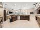 Open kitchen with granite counters, stainless appliances, and views into the sunny living area at 19107 Avenue Bayonnes, Lutz, FL 33558