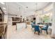 Open-concept kitchen with stainless steel appliances, granite counters, and seamless access to the patio at 19107 Avenue Bayonnes, Lutz, FL 33558