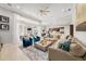 Spacious living room with large sectional, stylish decor, and expansive sliding glass doors leading to outdoor area at 19107 Avenue Bayonnes, Lutz, FL 33558