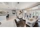 Bright living room with hardwood floors, plush seating, and a decorative chandelier, bathed in light at 19107 Avenue Bayonnes, Lutz, FL 33558