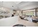 Open living room featuring hardwood floors, designer lighting, elegant furniture, and a neutral color palette at 19107 Avenue Bayonnes, Lutz, FL 33558