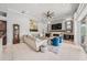 Cozy living room features a fireplace, plush seating, elegant decor, and seamless integration with the kitchen at 19107 Avenue Bayonnes, Lutz, FL 33558