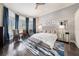 Serene main bedroom boasts hardwood floors, abundant natural light, and elegant furnishings for relaxation at 19107 Avenue Bayonnes, Lutz, FL 33558