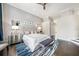 Bright main bedroom with decorative wallpaper, hardwood floors, and stylish furniture providing a cozy retreat at 19107 Avenue Bayonnes, Lutz, FL 33558