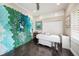 Multi-purpose room, ideal for an office or craft room, featuring a custom accent wall and ample storage at 19107 Avenue Bayonnes, Lutz, FL 33558