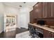 Comfortable home office with elegant built-ins, featuring dark wood tones and ample storage at 19107 Avenue Bayonnes, Lutz, FL 33558