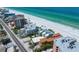 Beautiful aerial view showcasing beachfront condos along white sand beach and the clear blue ocean at 19530 Gulf Blvd # 4A, Indian Shores, FL 33785