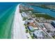 Wonderful aerial view highlighting condos along a pristine beach next to turquoise-colored ocean at 19530 Gulf Blvd # 4A, Indian Shores, FL 33785