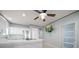 Modern kitchen with white cabinets, stainless steel appliances, and mounted television at 19530 Gulf Blvd # 4A, Indian Shores, FL 33785