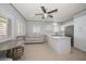 Open-concept kitchen with stainless steel appliances and seating area at 19530 Gulf Blvd # 4A, Indian Shores, FL 33785