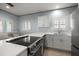 Bright kitchen with quartz countertops, stainless steel appliances, and ample counter space at 19530 Gulf Blvd # 4A, Indian Shores, FL 33785
