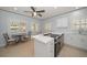 Bright kitchen with stainless steel appliances, quartz countertops, and eat-in area at 19530 Gulf Blvd # 4A, Indian Shores, FL 33785