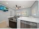 Updated kitchen featuring stainless steel appliances, island cooktop, and modern finishes at 19530 Gulf Blvd # 4A, Indian Shores, FL 33785