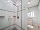 Beautiful glass shower stall featuring a pebble floor and white subway tile at 19530 Gulf Blvd # 4A, Indian Shores, FL 33785