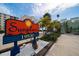 Colorful Sunplace community sign nestled among tropical plants and near attractive condos at 19530 Gulf Blvd # 4A, Indian Shores, FL 33785