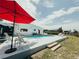 A beautiful backyard pool and outdoor lounge area enhance outdoor living at 1980 Forked Creek Dr, Englewood, FL 34223
