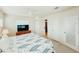 Bedroom with an ensuite bathroom and large windows at 1980 Forked Creek Dr, Englewood, FL 34223