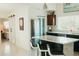 Bright kitchen features a granite island, sleek cabinetry, stainless steel appliances, and a convenient breakfast bar at 1980 Forked Creek Dr, Englewood, FL 34223