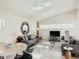 Airy living room with two skylights, recessed lighting, and modern furniture at 1980 Forked Creek Dr, Englewood, FL 34223