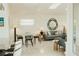 Open-concept living room and dining area with terrazzo floors and modern decor at 1980 Forked Creek Dr, Englewood, FL 34223