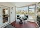 Enclosed porch with tiled flooring and views of the pool and outdoor seating area at 1980 Forked Creek Dr, Englewood, FL 34223