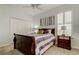 Comfortable bedroom with closet and bedside table, featuring neutral carpet at 2220 Elizabeth Way, Dunedin, FL 34698