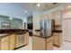 Bright breakfast nook off kitchen with granite breakfast bar and seating area at 2220 Elizabeth Way, Dunedin, FL 34698