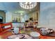 Dining area with a chandelier and a view of the kitchen and stainless steel appliances at 2220 Elizabeth Way, Dunedin, FL 34698