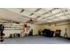 Spacious garage featuring overhead storage, painted floors, and room for storage at 2220 Elizabeth Way, Dunedin, FL 34698