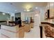 Open kitchen featuring granite countertops, stainless steel appliances, and an island with bar seating at 2220 Elizabeth Way, Dunedin, FL 34698