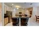 Well-equipped kitchen with an island, granite countertops, and stainless steel appliances at 2220 Elizabeth Way, Dunedin, FL 34698