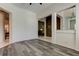 Spacious living room featuring wood-look flooring and an open layout at 2220 Elizabeth Way, Dunedin, FL 34698