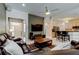 Open living space with tile floors, a ceiling fan, and views into the kitchen and dining area at 2220 Elizabeth Way, Dunedin, FL 34698
