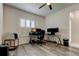 Brightly lit office with shutters, modern desk setup with dual monitors, and neutral walls perfect for productivity at 2220 Elizabeth Way, Dunedin, FL 34698