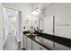 Bathroom featuring a countertop vessel sink, dark countertop, and white cabinets at 27012 Sea Breeze Way, Wesley Chapel, FL 33544