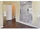 Bathroom featuring a glass shower with a tile surround at 27012 Sea Breeze Way, Wesley Chapel, FL 33544